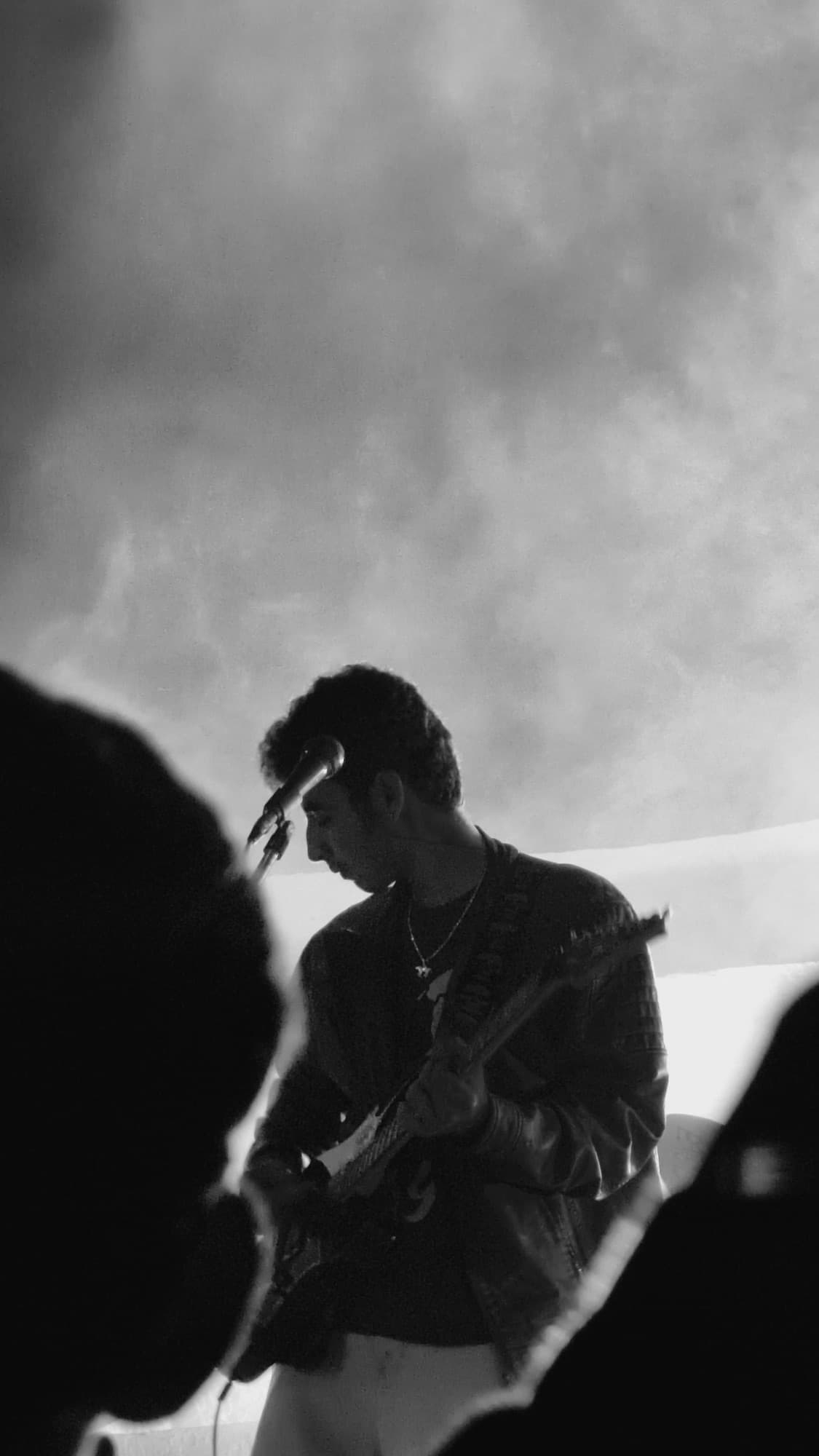 Black and white photograph of Pradhyuman performing on stage