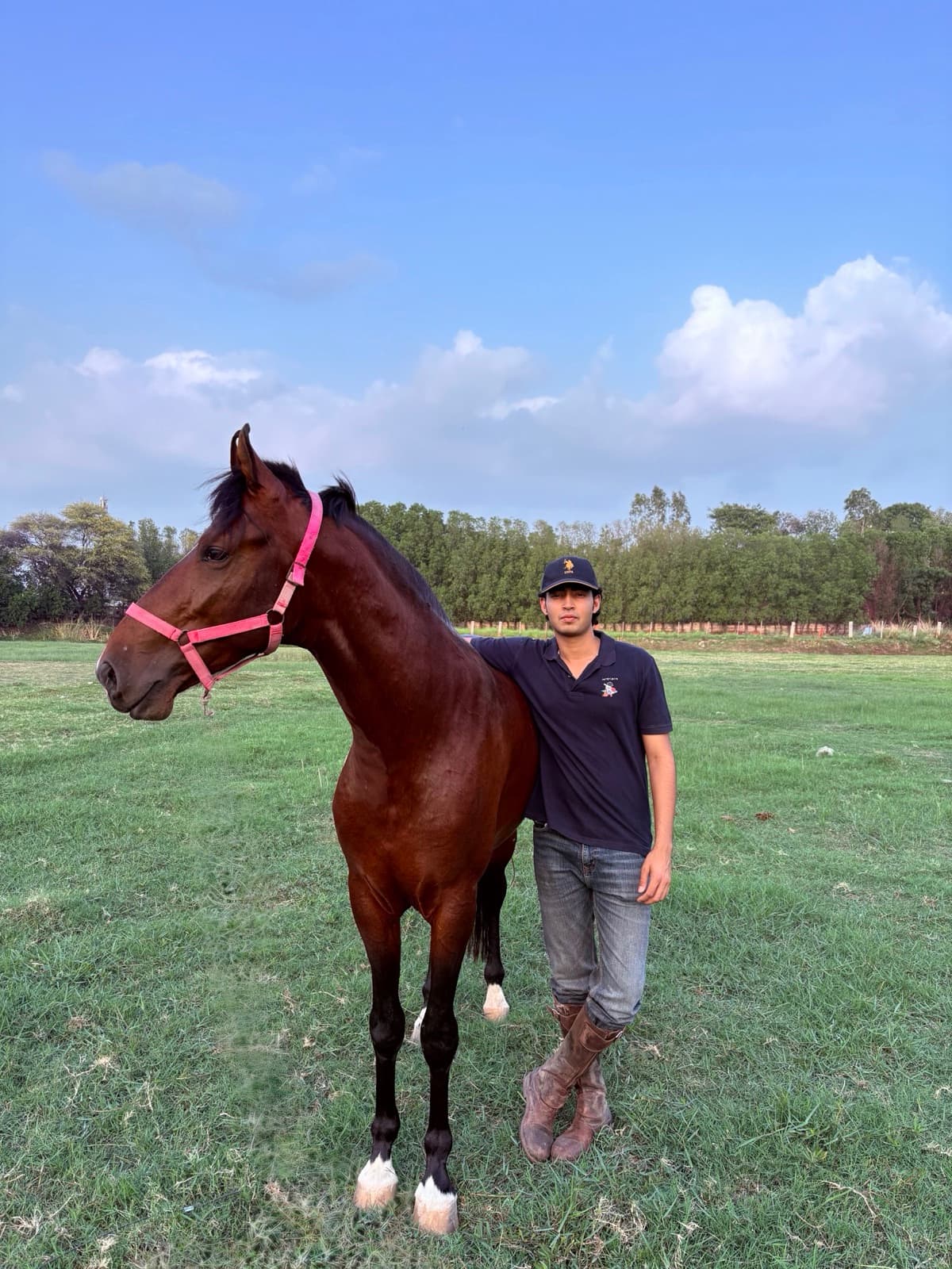 Pradhyuman with a horse from his stable